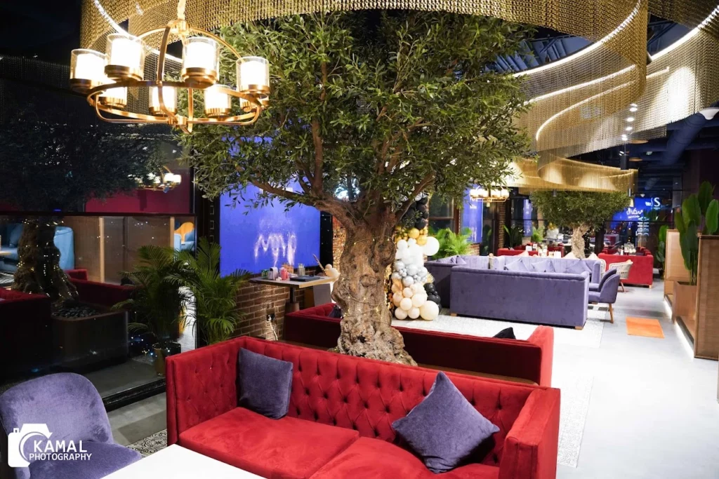 Statement artificial olive tree indoor Dubai restaurant, the perfect faux olive tree UAE for upscale interiors.