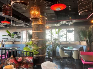 Modern indoor lounge with elegant artificial potted plants and stylish seating, supplied by artificial plant wholesalers in UAE