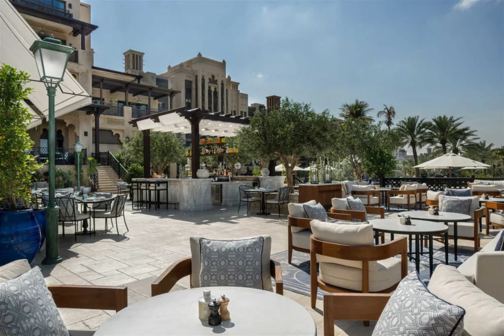Outdoor restaurant decor with sun resistant and low-maintenance plants in Dubai