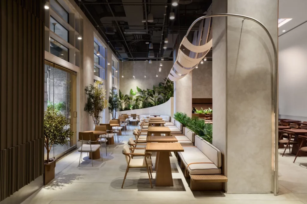 Premium greenery planter installed by artificial plants suppliers in Riyadh, elevating a modern hospitality corridor.